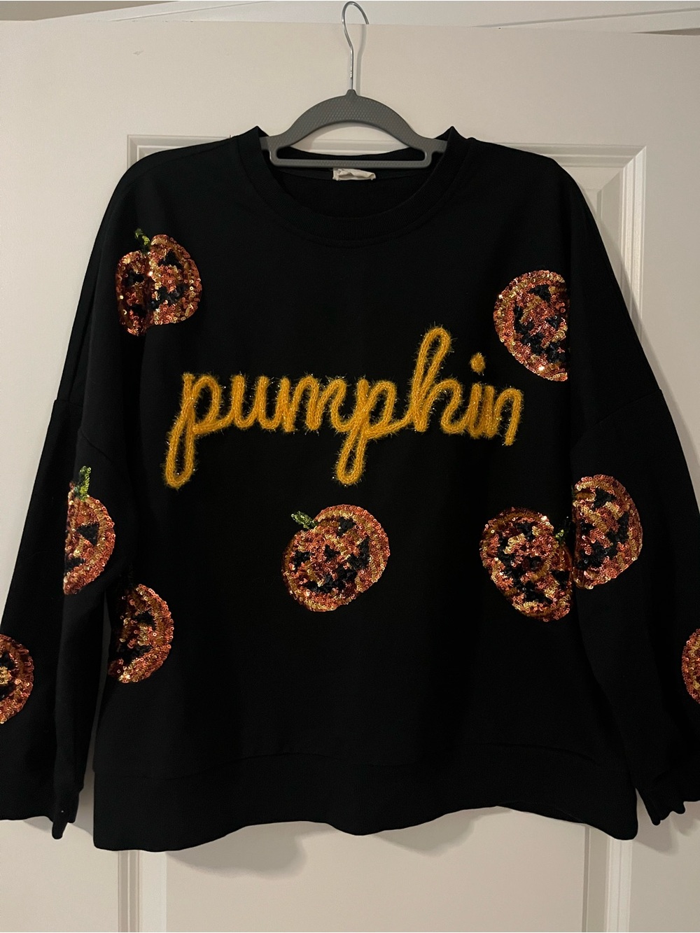 BiBi Black Crewneck Sweater with Yellow 'Pumpkin' Script and Sequin Pumpkins